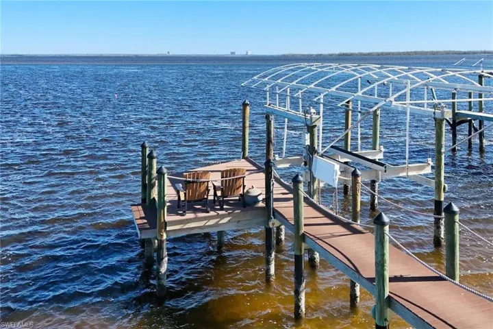 Sitting area at the end of the dock. Your Front Row Seats to watch the Dolphins and Manatees Play! Boat canopy is not being replaced but a new owner can have one!