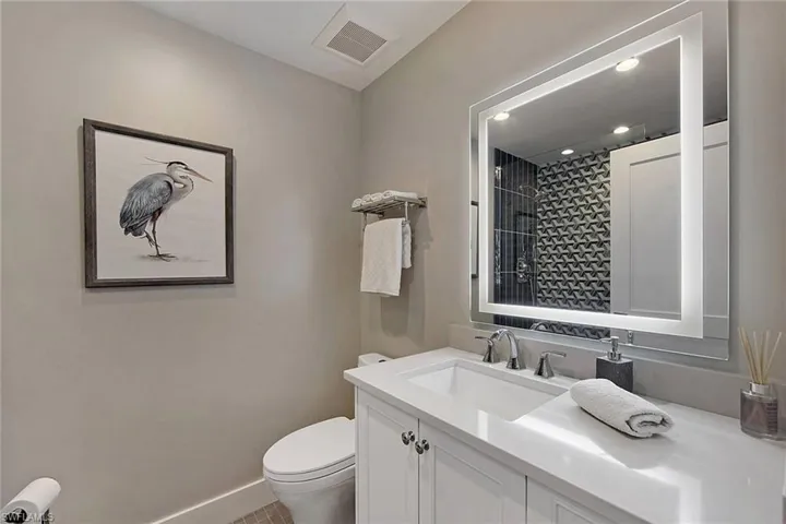 Guest Bath with Silestone counter, LED mirror, & WOW shower tile!