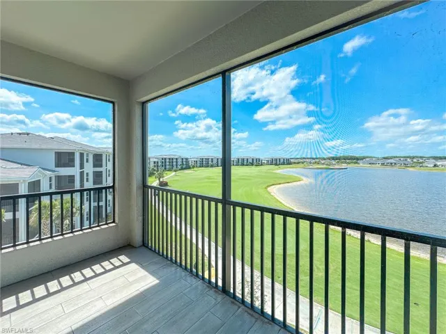 Unfurnished sunroom with a water view