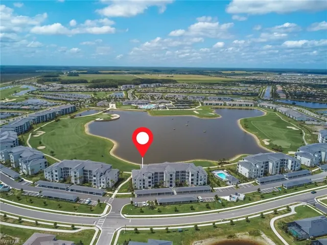 Drone / aerial view of a large body of water and a golf club