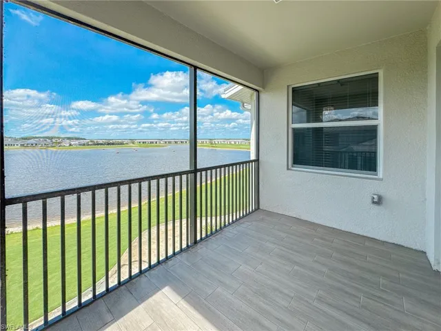 Unfurnished sunroom with a water view