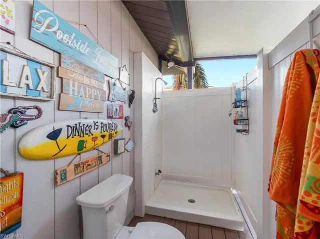 Bathroom with toilet and walk in shower