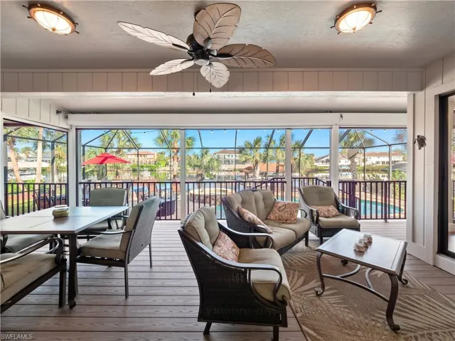 Sunroom / solarium featuring ceiling fan