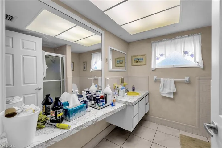 Bathroom with a shower stall and vanity