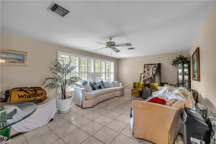 Living area featuring ceiling fan