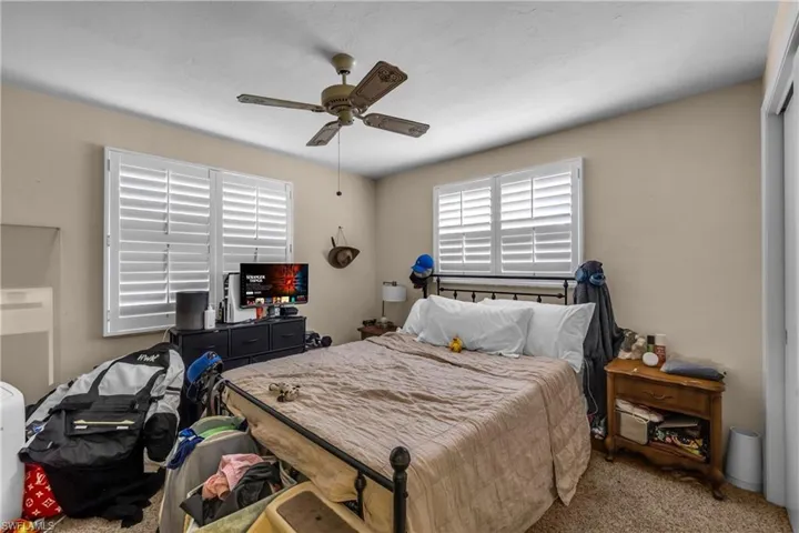 Bedroom featuring carpet and a ceiling fan