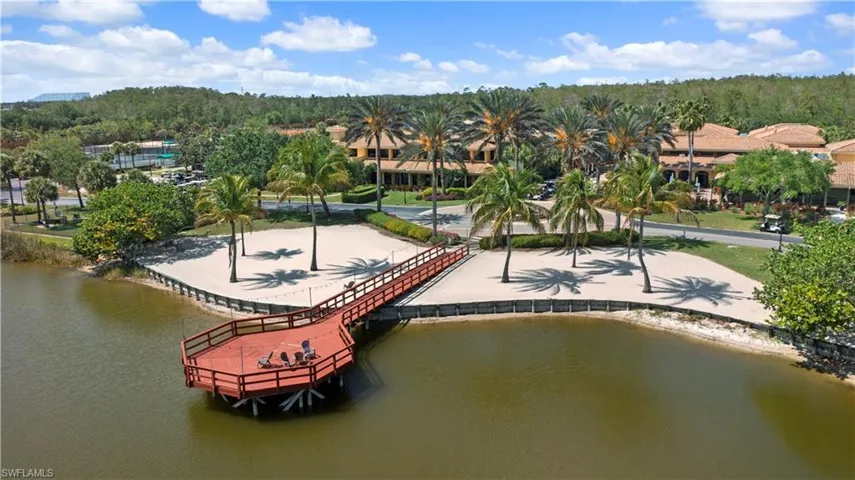 Birds eye view of property with a water view