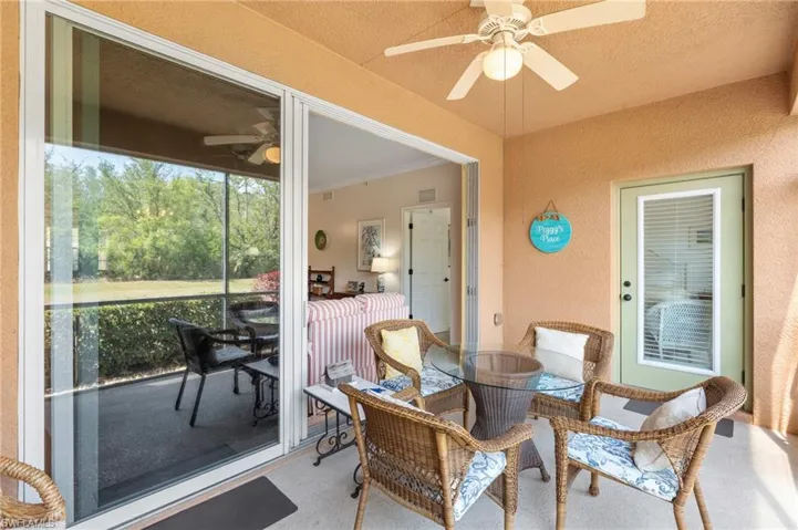 Sunroom / solarium with visible vents and ceiling fan