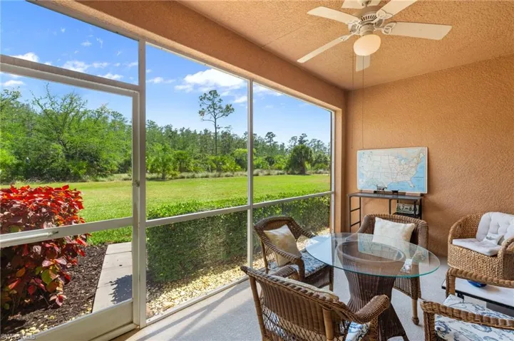 Sunroom / solarium with a ceiling fan