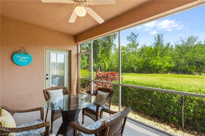 Sunroom / solarium with a ceiling fan