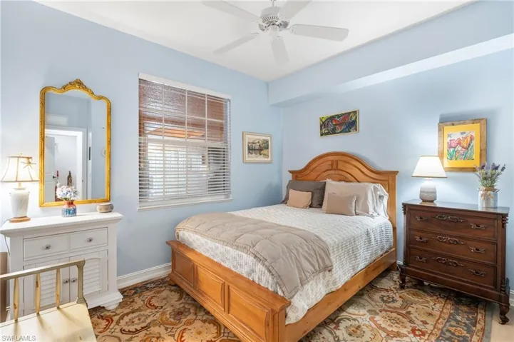 Bedroom with baseboards and a ceiling fan