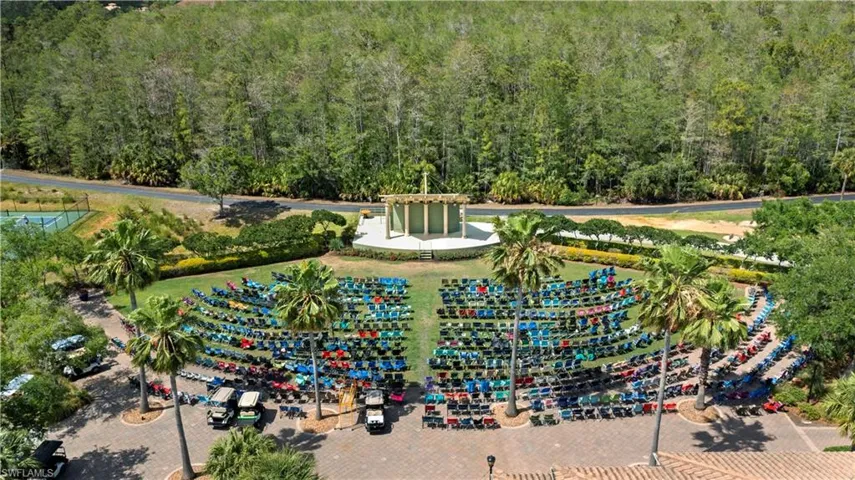 Aerial view featuring a forest view