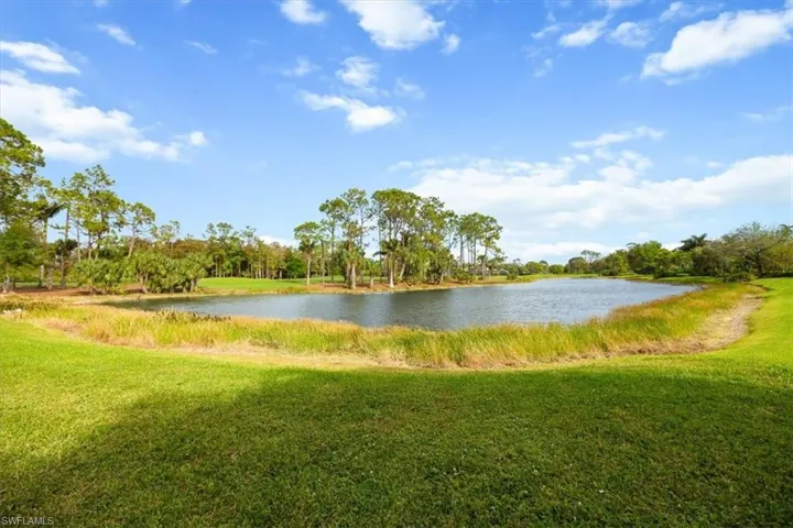 View of backyard, water and fairway