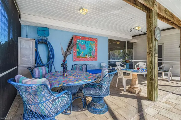 Screened pool lanai includes furniture.