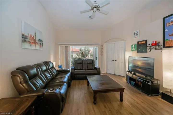 Large space for entertaining or relaxing! Sliders lead out to lanai, double doors to the right go to the Primary Suite.