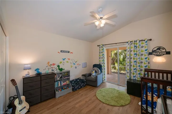 Extra bedroom at rear of house has sliders out to the lanai.