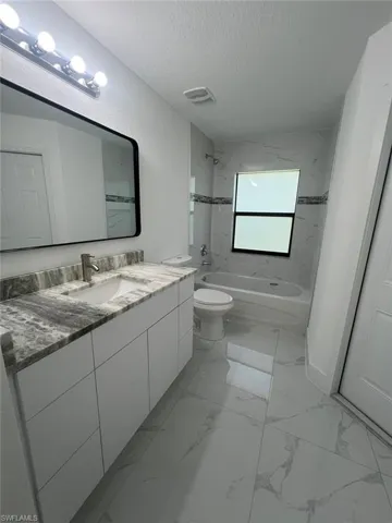 704  Henry  AVE, Lehigh Acres, FL 33972