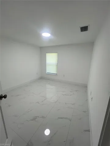 704  Henry  AVE, Lehigh Acres, FL 33972