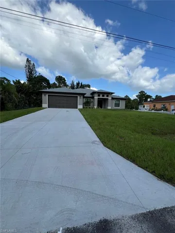 704  Henry  AVE, Lehigh Acres, FL 33972