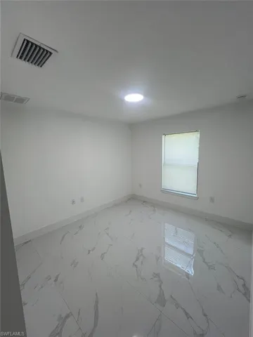 704  Henry  AVE, Lehigh Acres, FL 33972