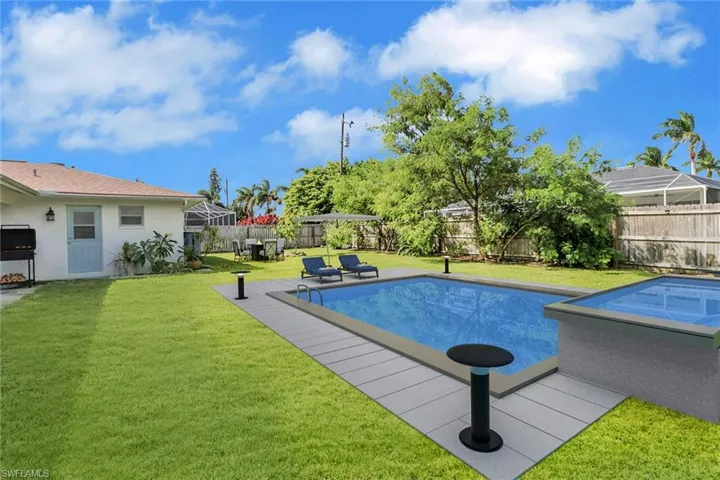 View of swimming pool with a patio, a fenced backyard, and a deck