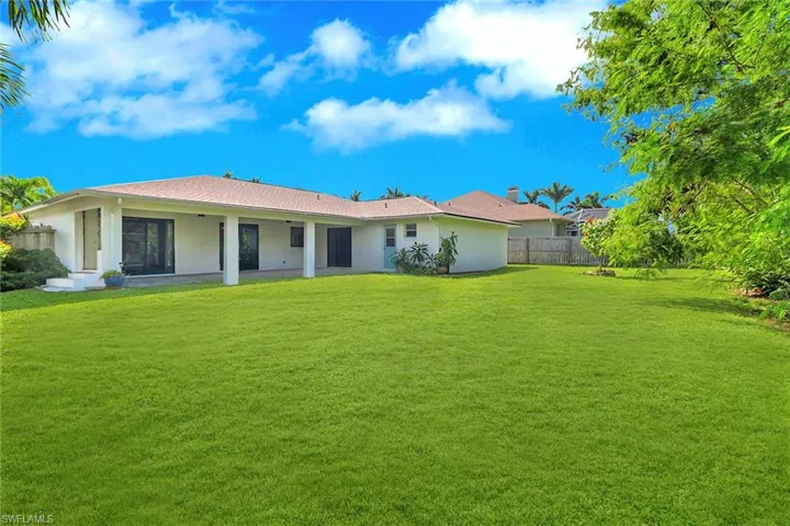 Rear view of property with a patio area and stucco siding