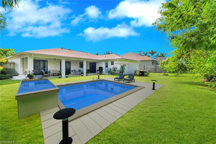 View of pool featuring a patio area and a wooden deck