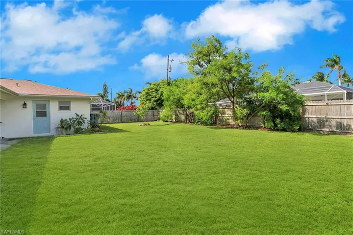 View of fenced backyard