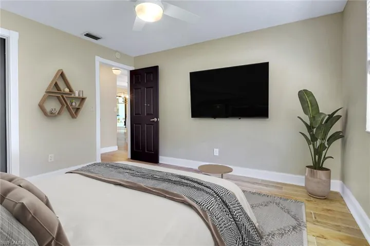 Bedroom featuring light wood-style floors and a ceiling fan