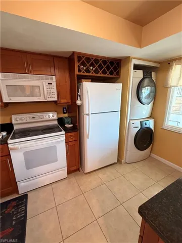Washer and Dryer are conveniently located in the kitchen.