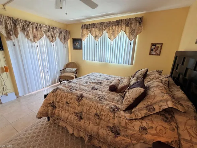 The large Guest Bedroom with sliders that lead to the screened front Lanai