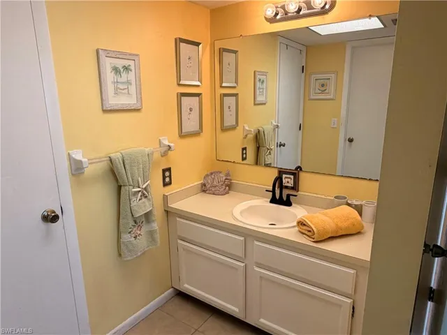Guest Bath room has a large walk-in closet