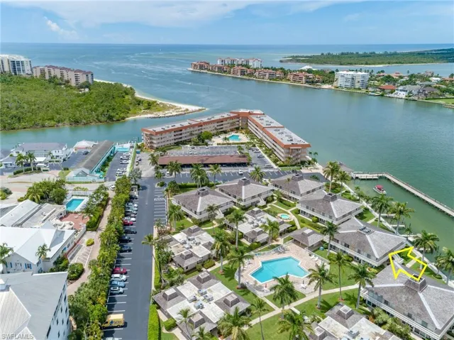 View of urban area featuring a pool area and a nearby body of water