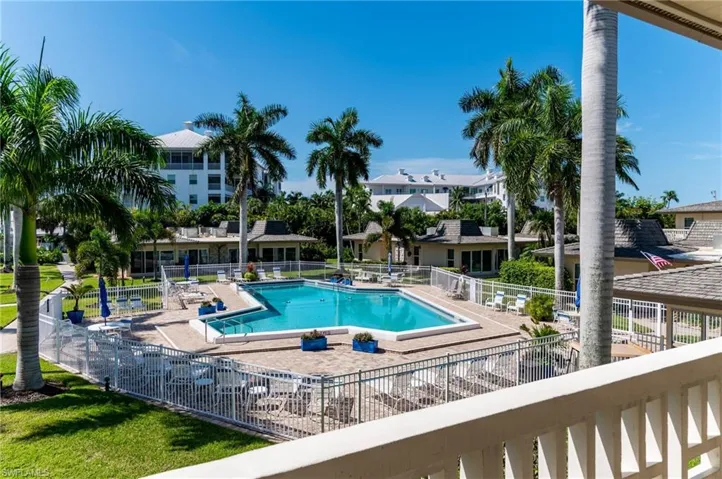 Community pool with a patio