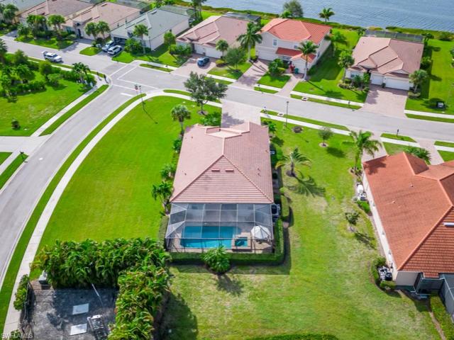 An aerial perspective encapsulates a lifestyle where luxury meets functionality, where the home becomes a private retreat against the backdrop of the highly desired Madison Park subdivision.