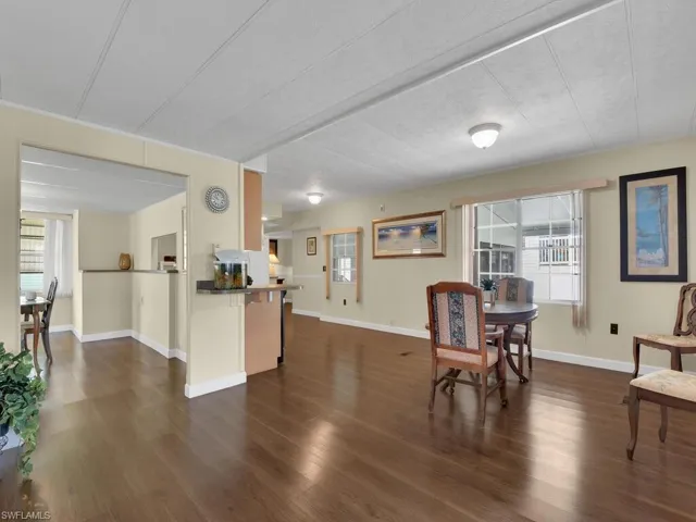 Dining room featuring dark wood-type flooring