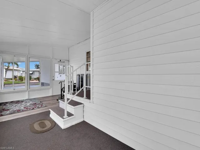 Sunroom with lofted ceiling