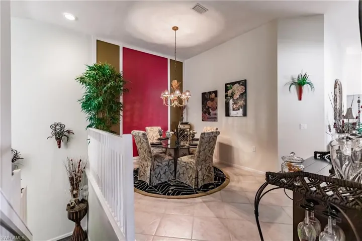 Dining room featuring a chandelier and light tile patterned floors