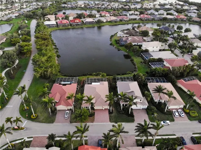 Drone / aerial view featuring a water view and a residential view