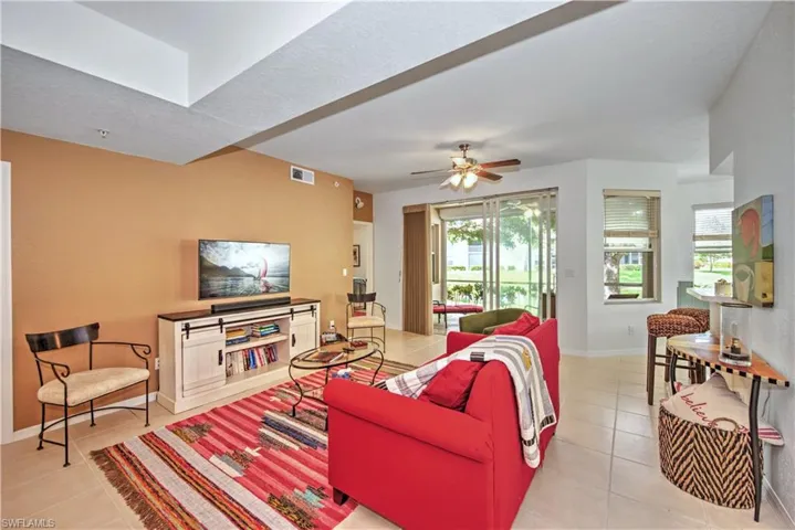 Living room with light tile patterned flooring