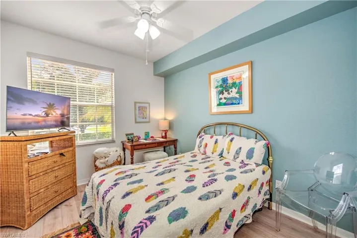 Bedroom featuring light wood finished floors and ceiling fan
