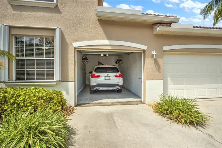Garage featuring driveway