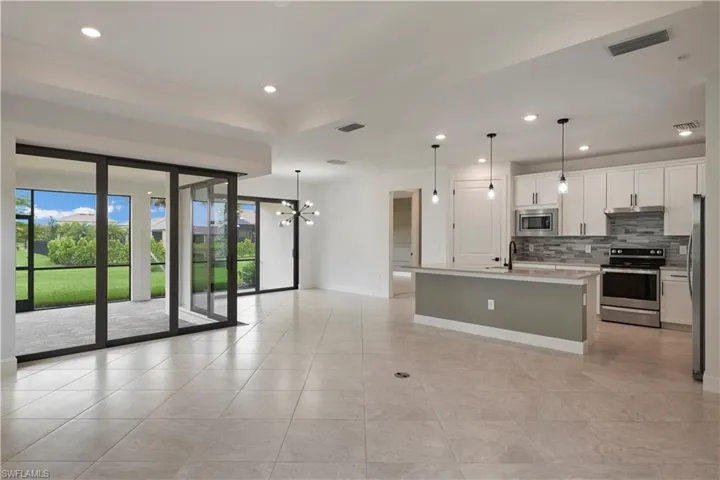 Living room, dining room, and kitchen views