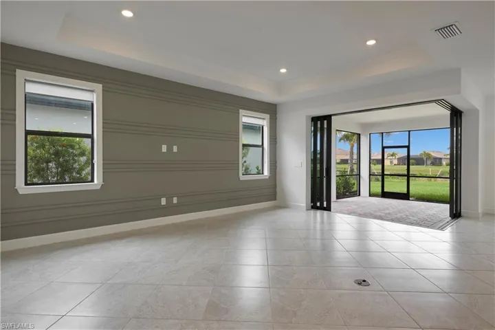 Living room featuring a tray ceiling