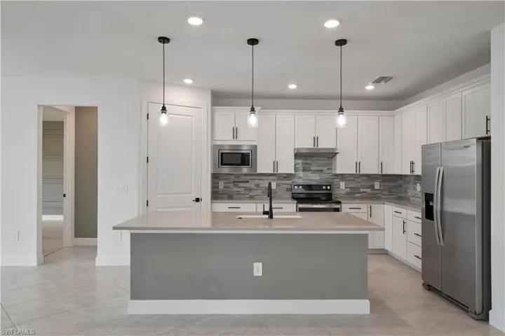 Kitchen with island featuring primary room