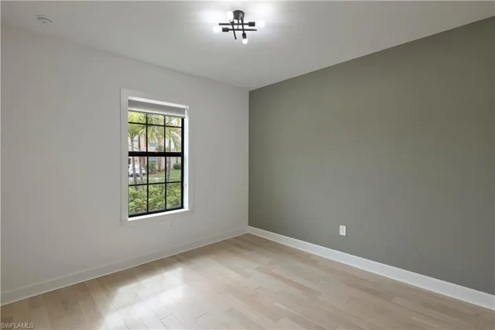Guest room featuring light and hardwood flooris