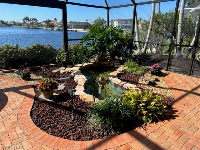 Water feature inside pool cage for extra relation.