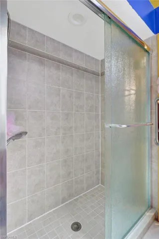Bathroom with a shower with door