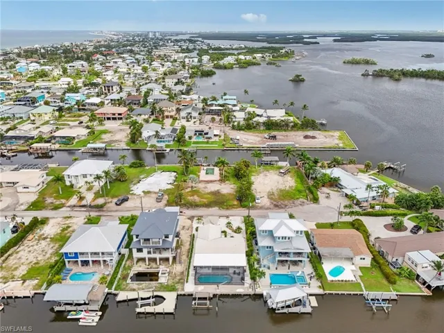 Aerial view of residential area with a nearby body of water