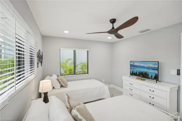 Bedroom featuring recessed lighting and a ceiling fan